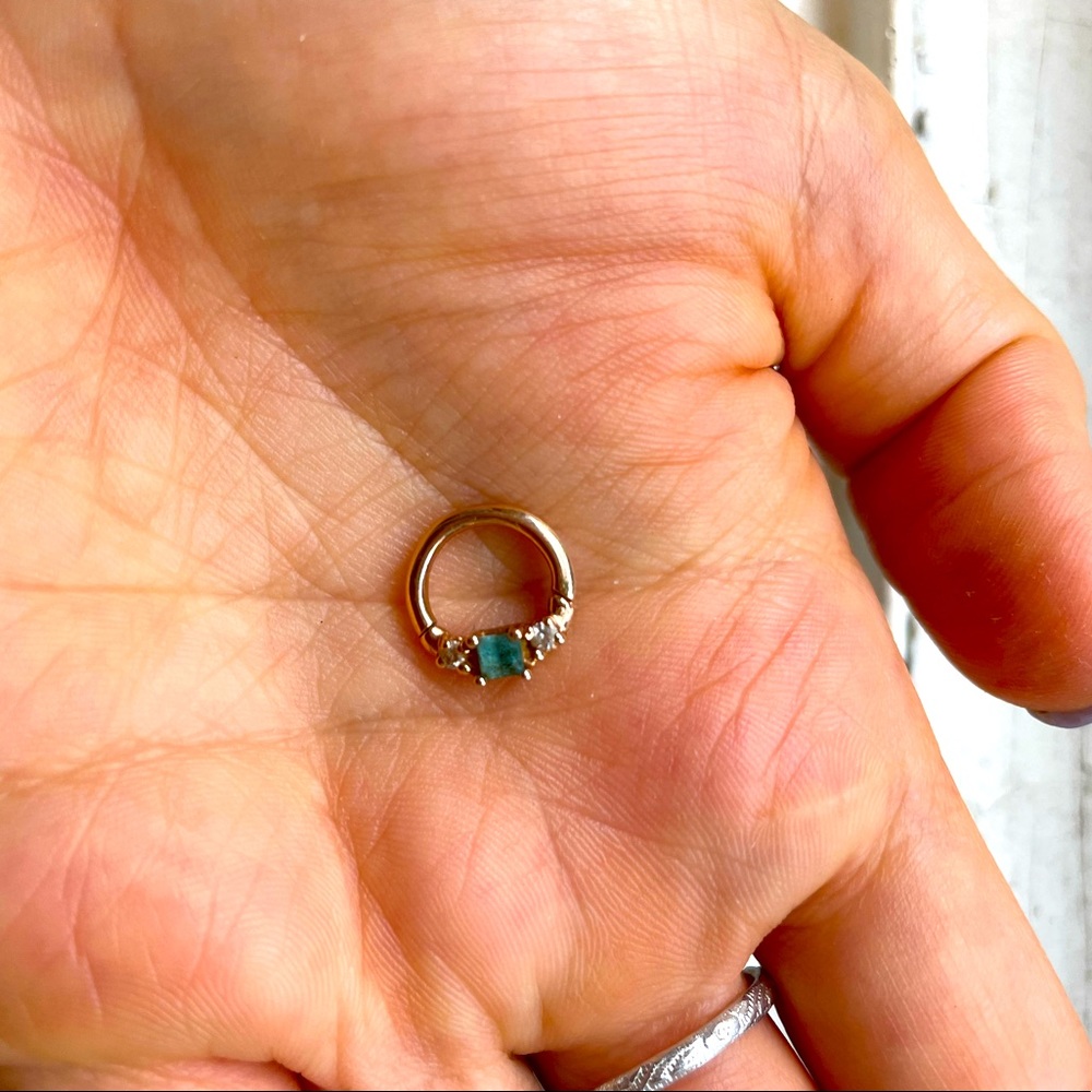 Solid 14k rose gold Venus by Maria Tash clicker at 14g.